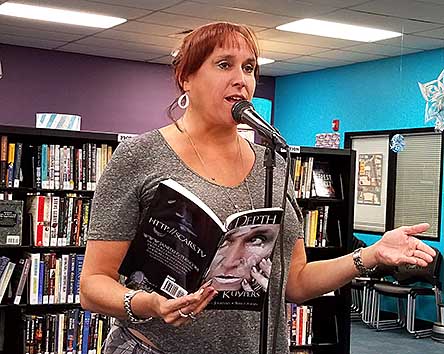Janet reading from In Depth at Rercycled Reads 20180805