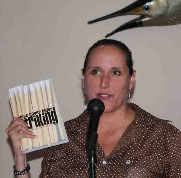 Janet Kuypers with her book Close Cover Before Striking at the Cafe 07/05/11