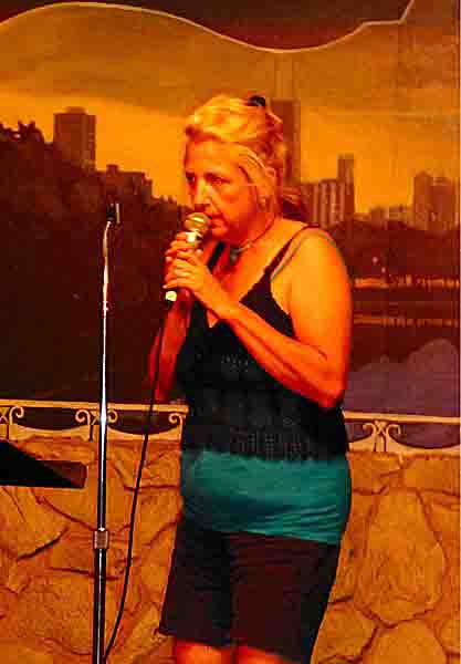Lynn West at the Cafe Gallery July 4 2012, photograph by and Copyright (c) 2012 Ned Haggard - used with permission,