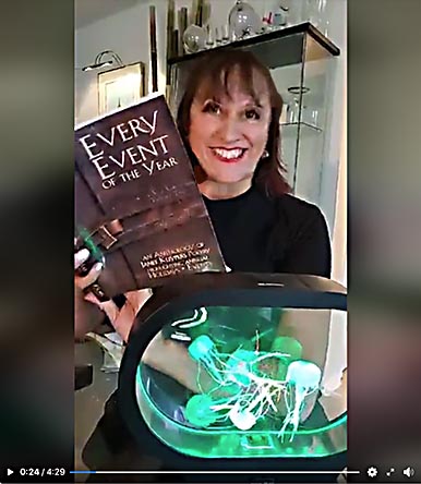 video still from Janet Kuypers reading her poem “Zoos, Big Brains and Opposable Thumbs– from her book “Every Event of the Year (Volume Two: July-December)”