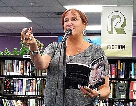 Janet reading from In Depth at Rercycled Reads 20180805