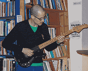 Jeremy Evan playing the guitar, live at  their Chicago show 01-29-07 at Myopic Books