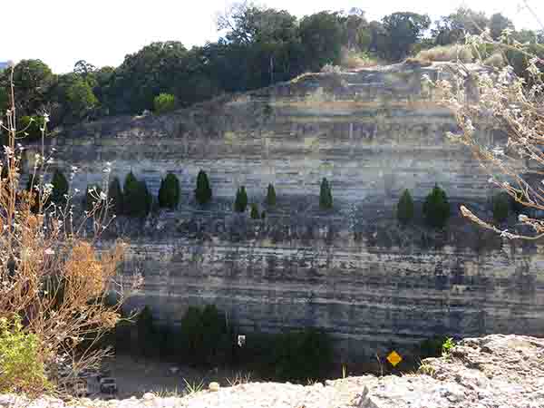 a rocky nature scene in Austin Texas, with portions of i94 north Chicago for the nearby road, copyright 2017 Janet Kuypers