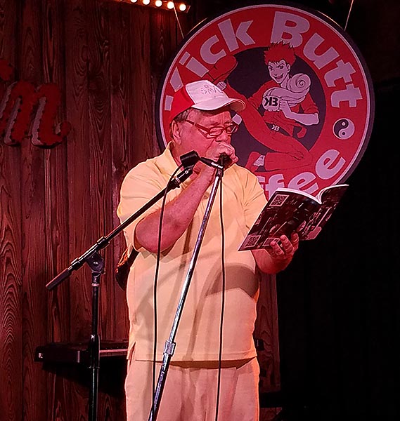 Thom Woodruff reading his poem A Billionaire is Offering Millions from Forbidden at the Spoken and Heard open mic at Kck Butt Coffee