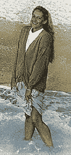 Kuypers holding her skit while standing in lake Michigan, in Michigan