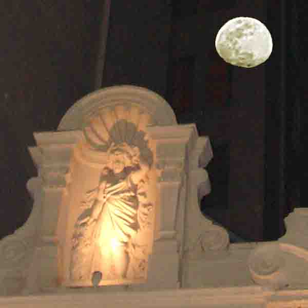 the moon over a building in New Orleans, coyright 2010 - 2016 Janet Kuypers
