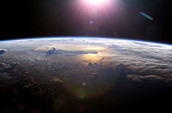 Earth’s horizon as the sunsets over the Pacific Ocean was taken 7/21/03 by an Expedition 7 crewmember onboard the International Space Station (ISS).