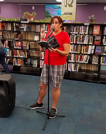 Janet with the book “Let Me See You Stripped” at Recycled Reads 10/21/17