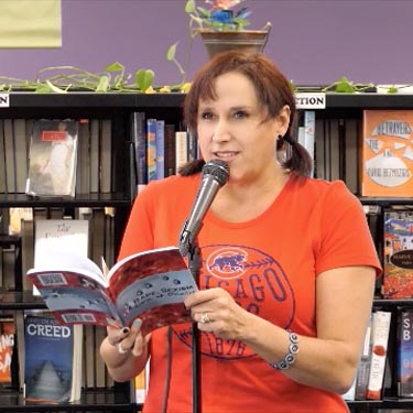 Janet with the book “Rape, Sexism, Life & Death” at Recycled Reads 10/21/17