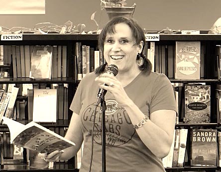 Janet with the book “Rape, Sexism, Life & Death” at Recycled Reads 10/21/17