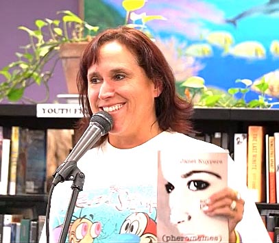 video still of Janet Kuypers reading from her book “(pheromemes) 2015-2017 poems” live