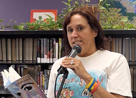 video still of Janet Kuypers reading from her book “(pheromemes) 2015-2017 show poems” live