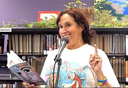 video still of Janet Kuypers reading from her book “(pheromemes) 2015-2017 show poems” live