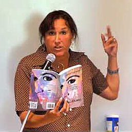 video still of Janet Kuypers reading from her book “(pheromemes) 2015-2017 show poems” live