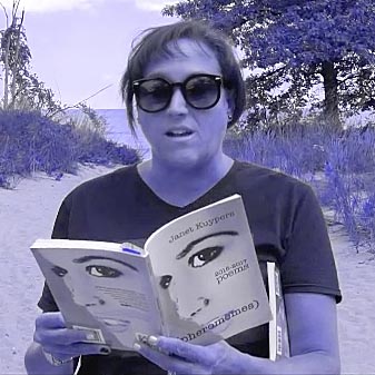 video still of Janet Kuypers reading from her book “(pheromemes) 2015-2017 poems” live