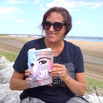 video still of Janet Kuypers reading from her book “(pheromemes) 2015-2017 show poems” live