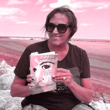 video still of Janet Kuypers reading from her book “(pheromemes) 2015-2017 show poems” live
