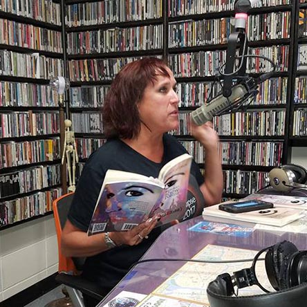 video still of Janet Kuypers reading from her book “(pheromemes) 2015-2017 show poems” live