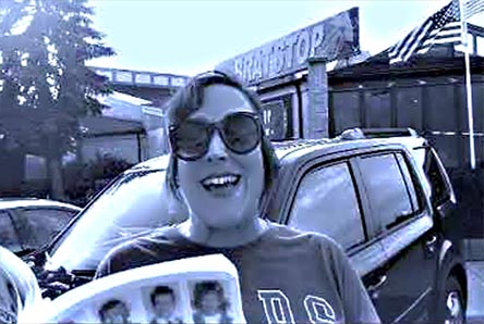 video still from Janet Kuypers reading from the book in from of the Brat Stop restaurant in Kenosha, WI 9/2/19