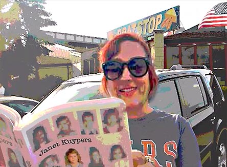 video still from Janet Kuypers reading from the book in from of the Brat Stop restaurant in Kenosha, WI 9/2/19