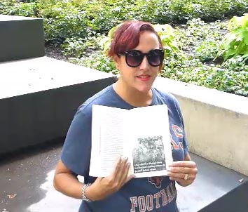 video still from Janet Kuypers reading from the book near the Ditka bobblehead statue Labor Day weekend at Millenium Park in Chicago 9/2/19